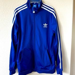 Adidas track jacket with zipper pockets and stitched logo; gently worn